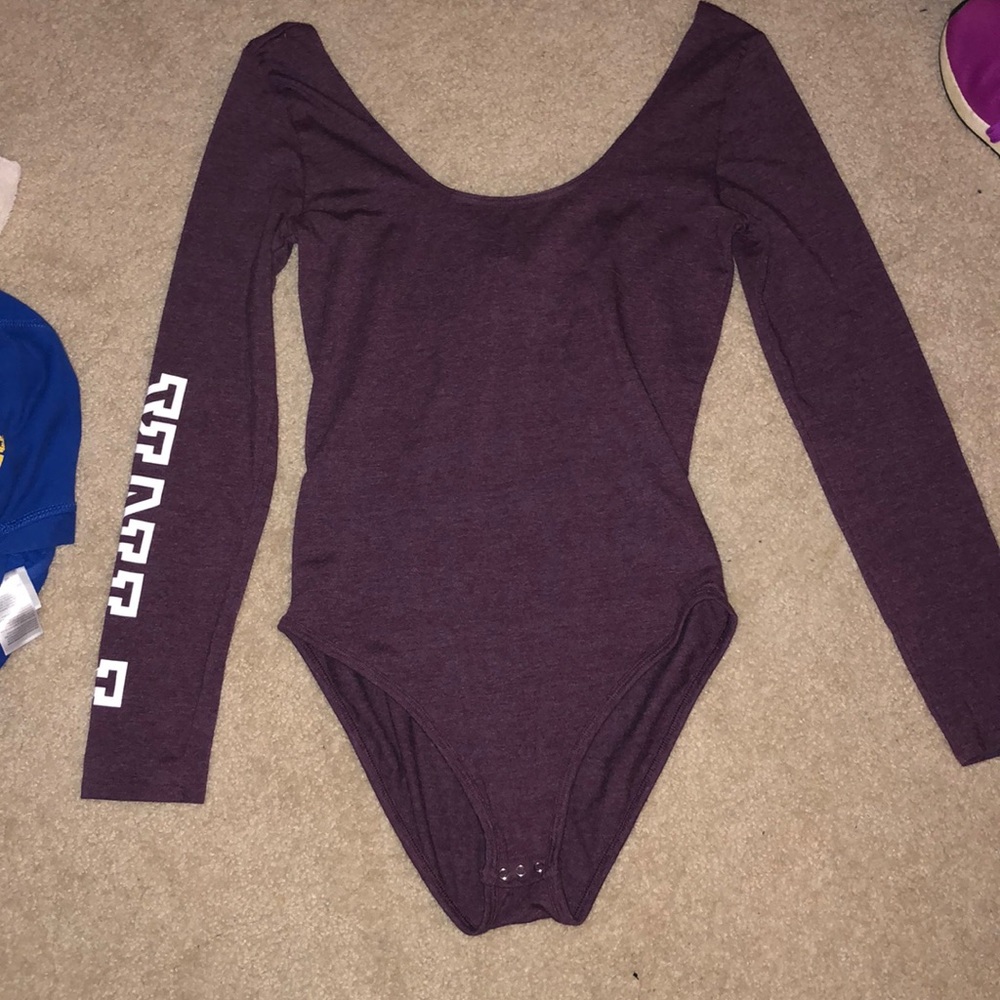 Pink body suit.